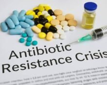 Visual representation of antibiotic resistance crisis with resistant bacteria and medical vials