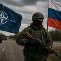 Image showing Russian soldier near a NATO border checkpoint with tanks and warning signs, symbolizing the rising Russia-NATO conflict in Eastern Europe